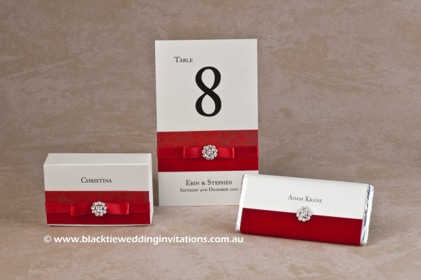 red - favour box, table number and personalised chocolate